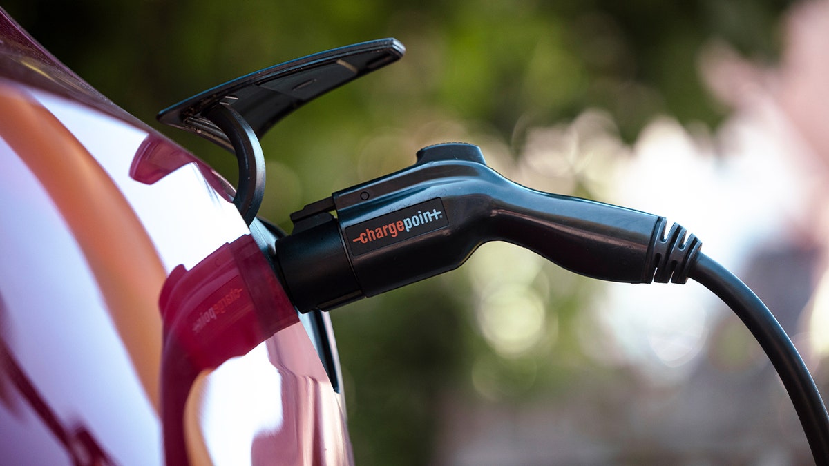 A Tesla Model 3 charges at a ChargePoint electric vehicle charging station in Rhinebeck, New York, on Sept. 3.