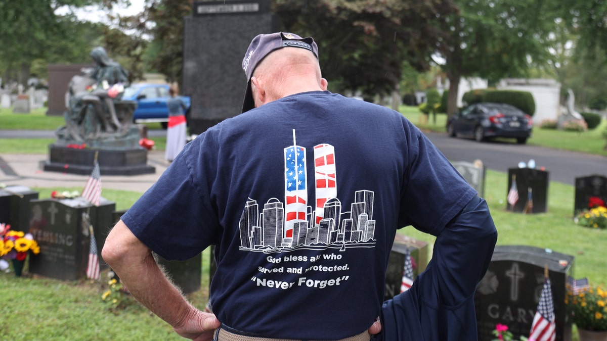 A man honoring a fallen firefighter