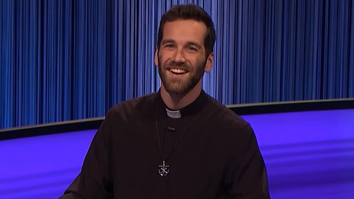 A photograph  of Father Steve Jakubowski connected  "Jeopardy!"