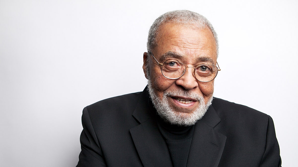 Award-winning actor James Earl Jones wears black suit.