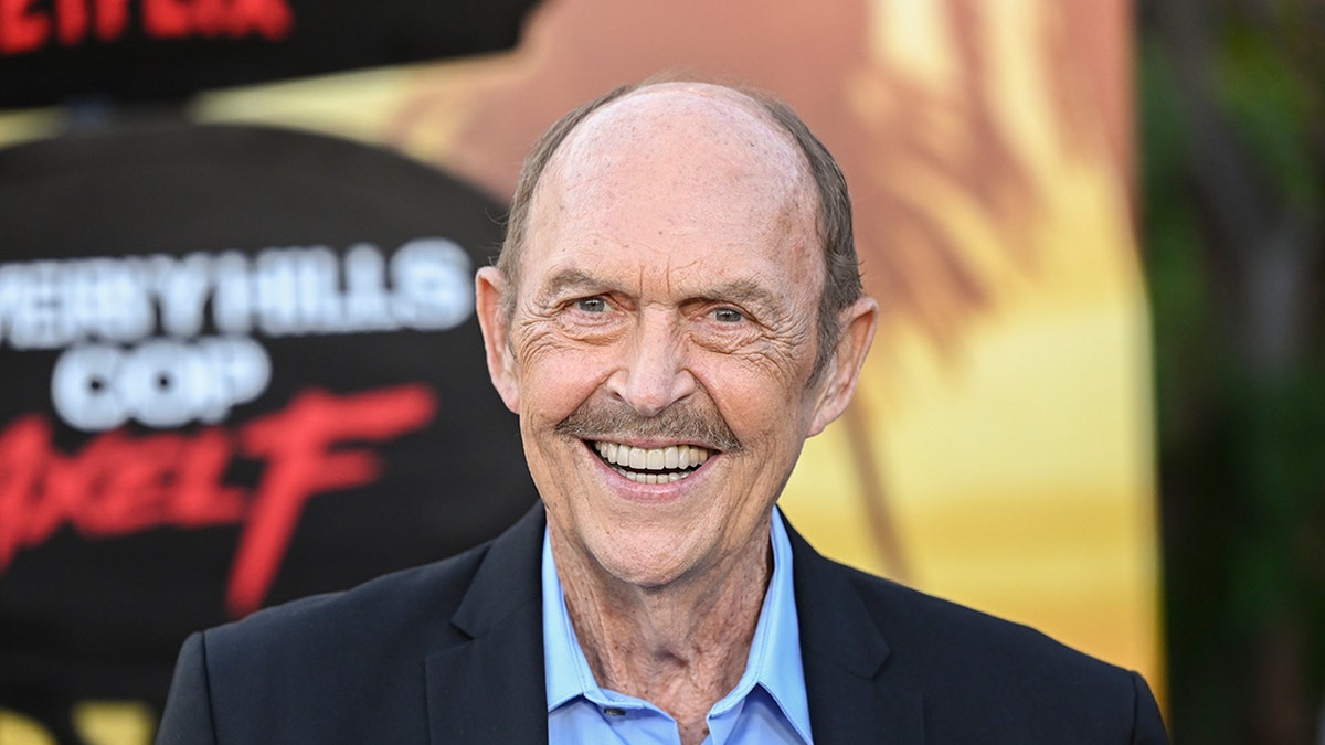 Actor John Ashton smiles on the red carpet at the premiere of Beverly Hills Cop: Axel F.