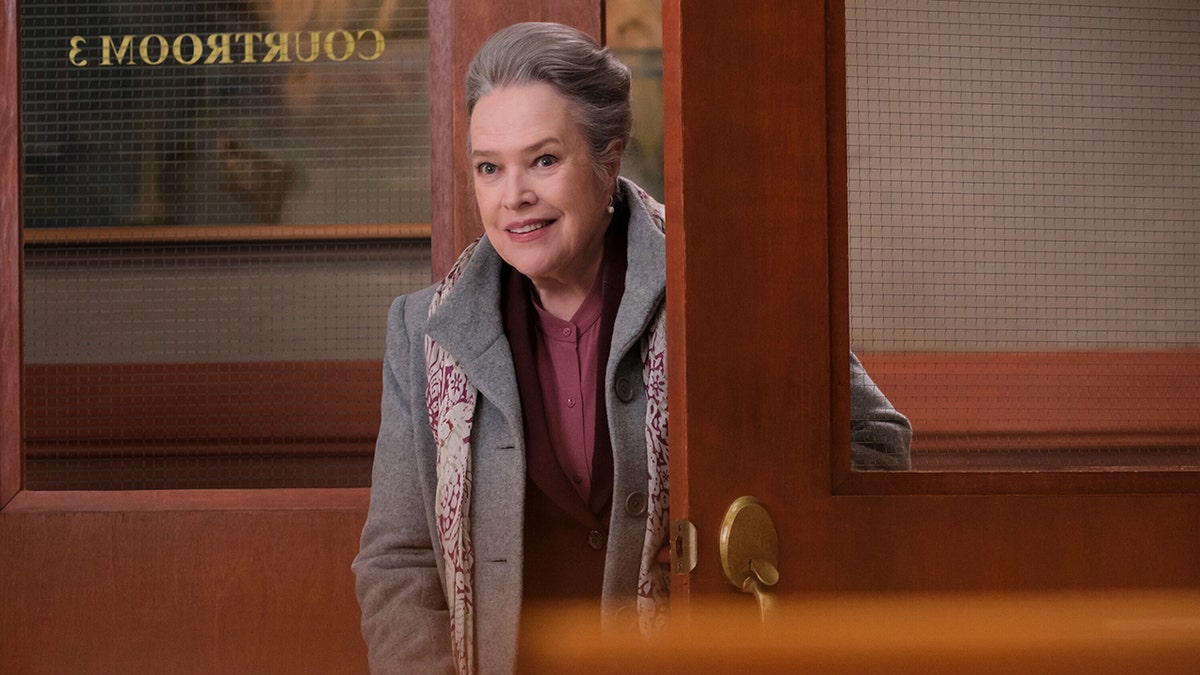 Kathy Bates bundles up   successful  a agelong  overgarment  connected  Matlock set.