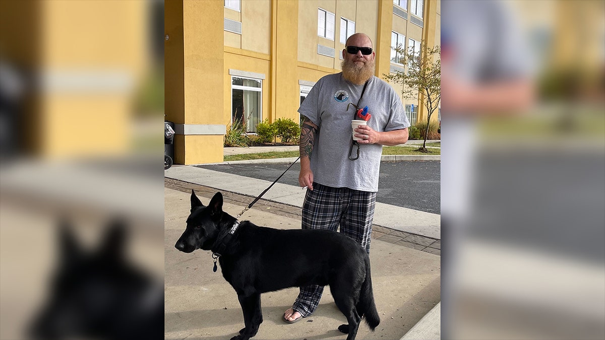 Mark, from Hershey, Pa., takes dog out on walk