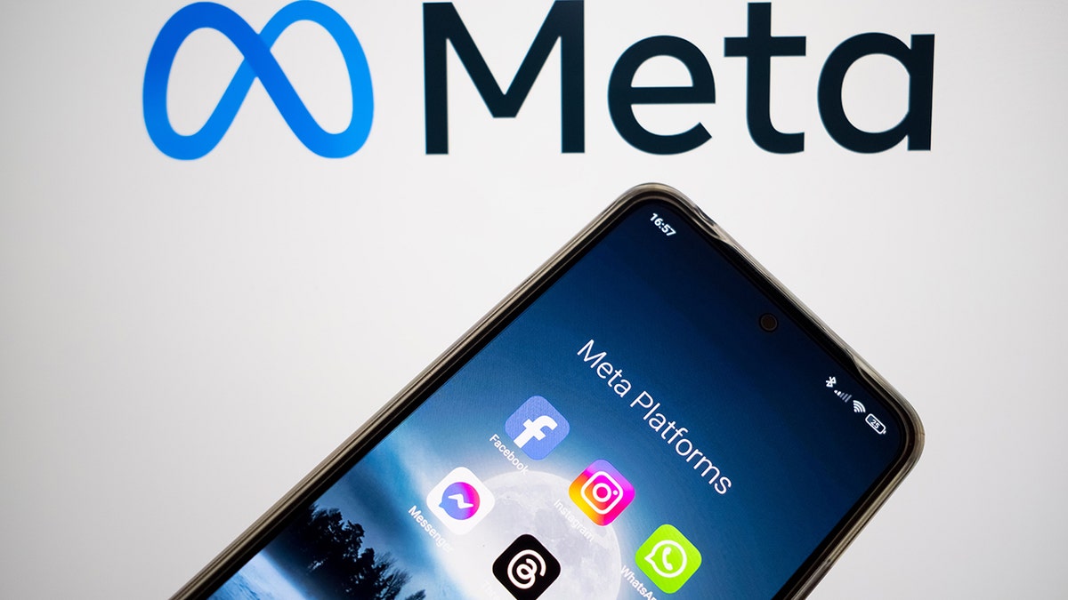 Meta logo with phone in background