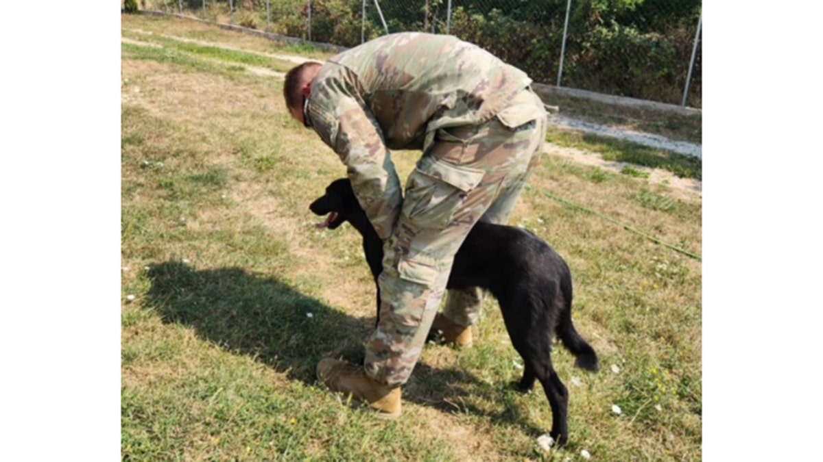 Sergeant Nico and Mia outside