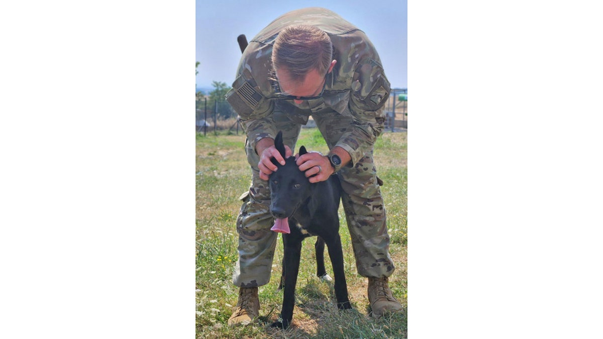 Sergeant Nico plays with Mia