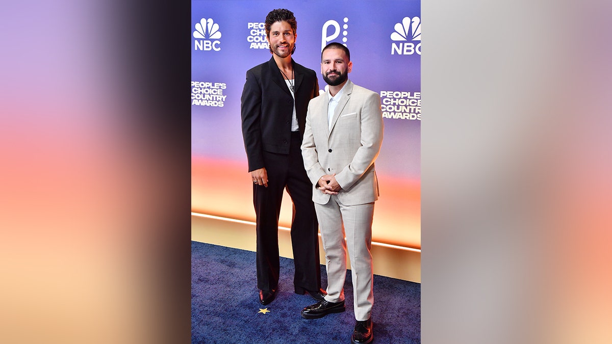 Dan + Shay looked dapper arsenic  they walked the reddish  carpet astatine  the 2024 People's CHoice Country Awards.