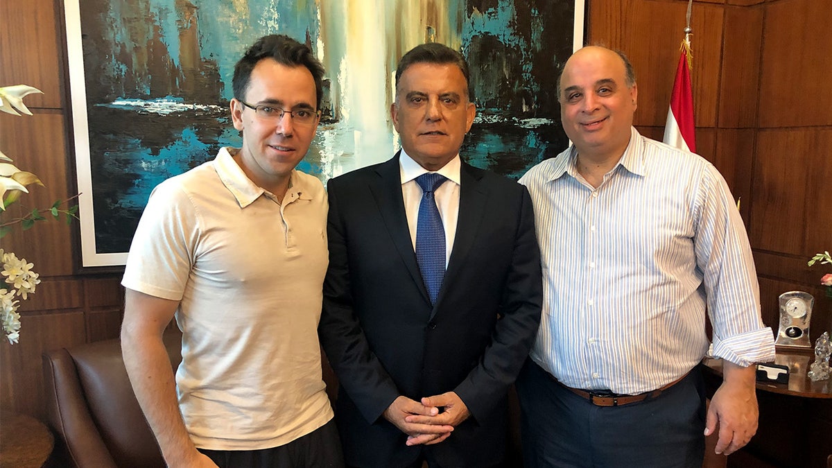 Sam Goodwin with two men in Lebanon