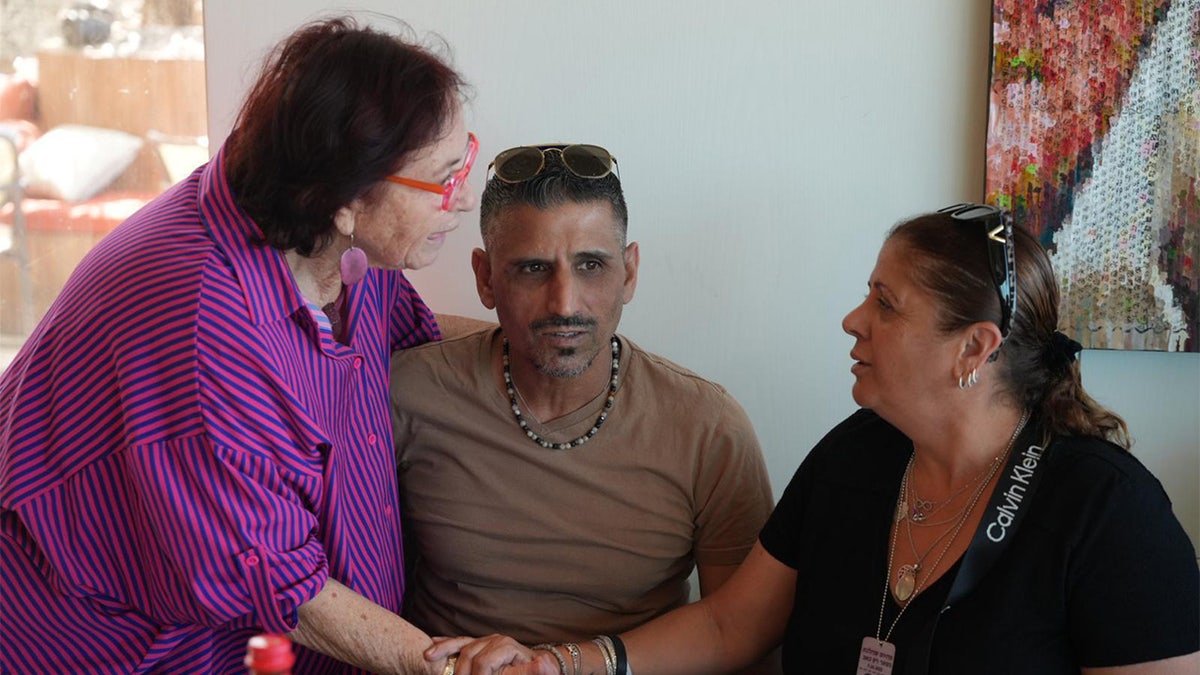 Sigal and her husband Oren meet with OneFamily coordinator, Nava (left).