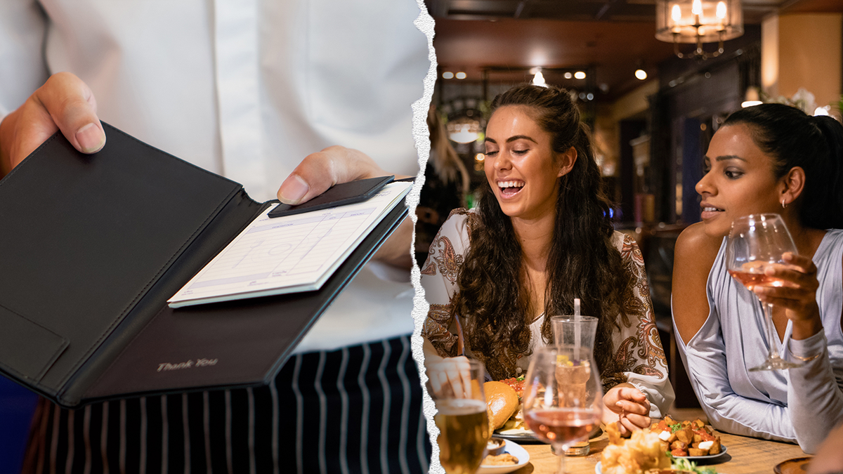 Waiter with check and people laughing at dinner together