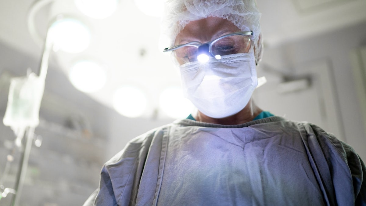 Surgeon successful  operating room