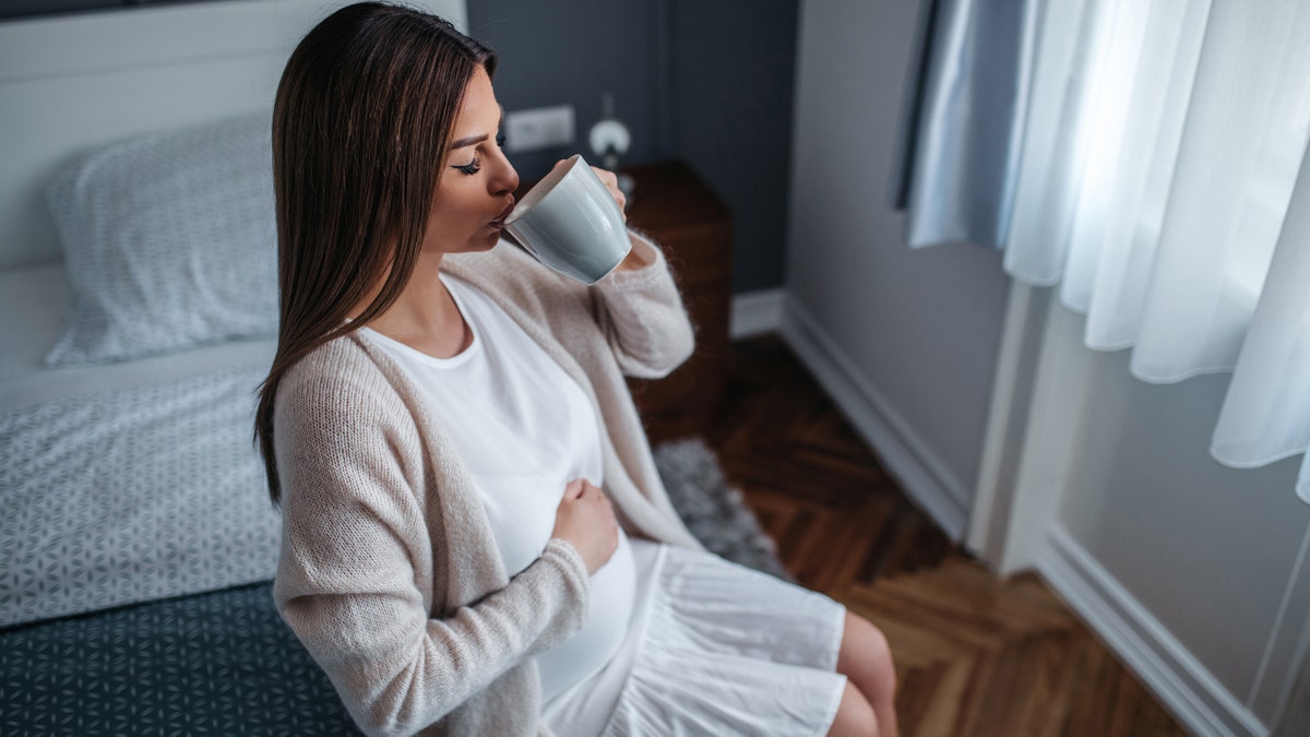 A woman drinking tea before bed