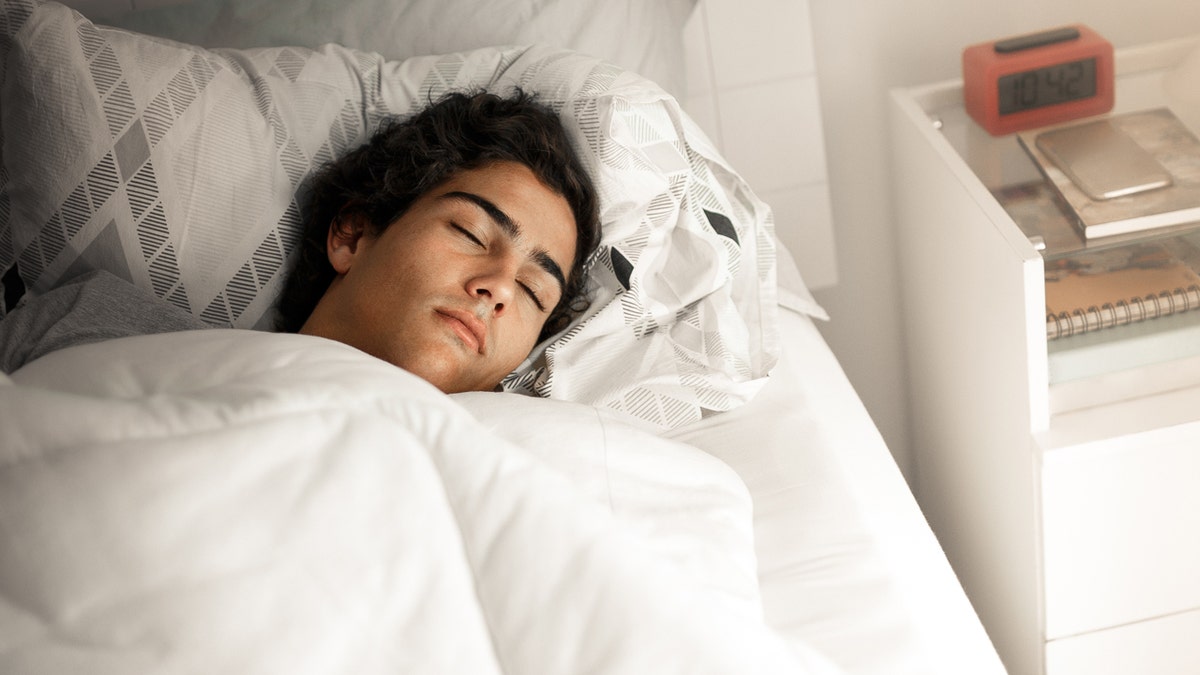 Teenager sleeping successful  bed