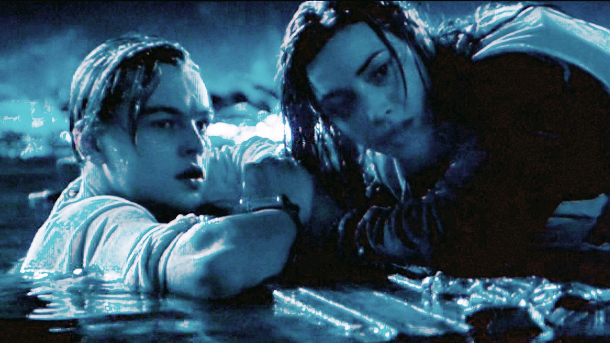 Jack (Leonardo DiCaprio) and Rose (Kate Winslet) during the door scene in 'Titanic,' with a blue hue to the photo