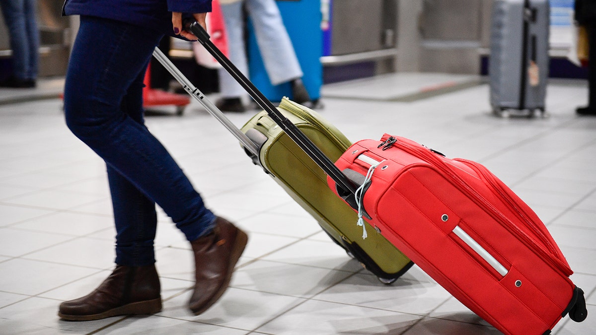 traveling with luggage at the airport