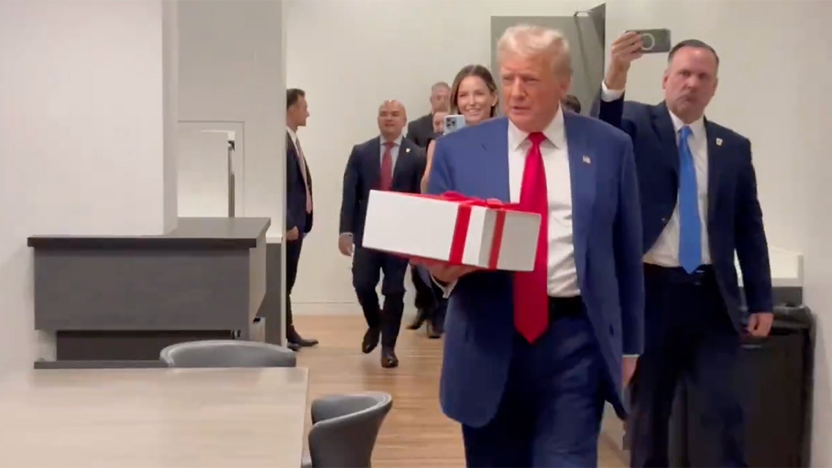 Donald Trump carries present 