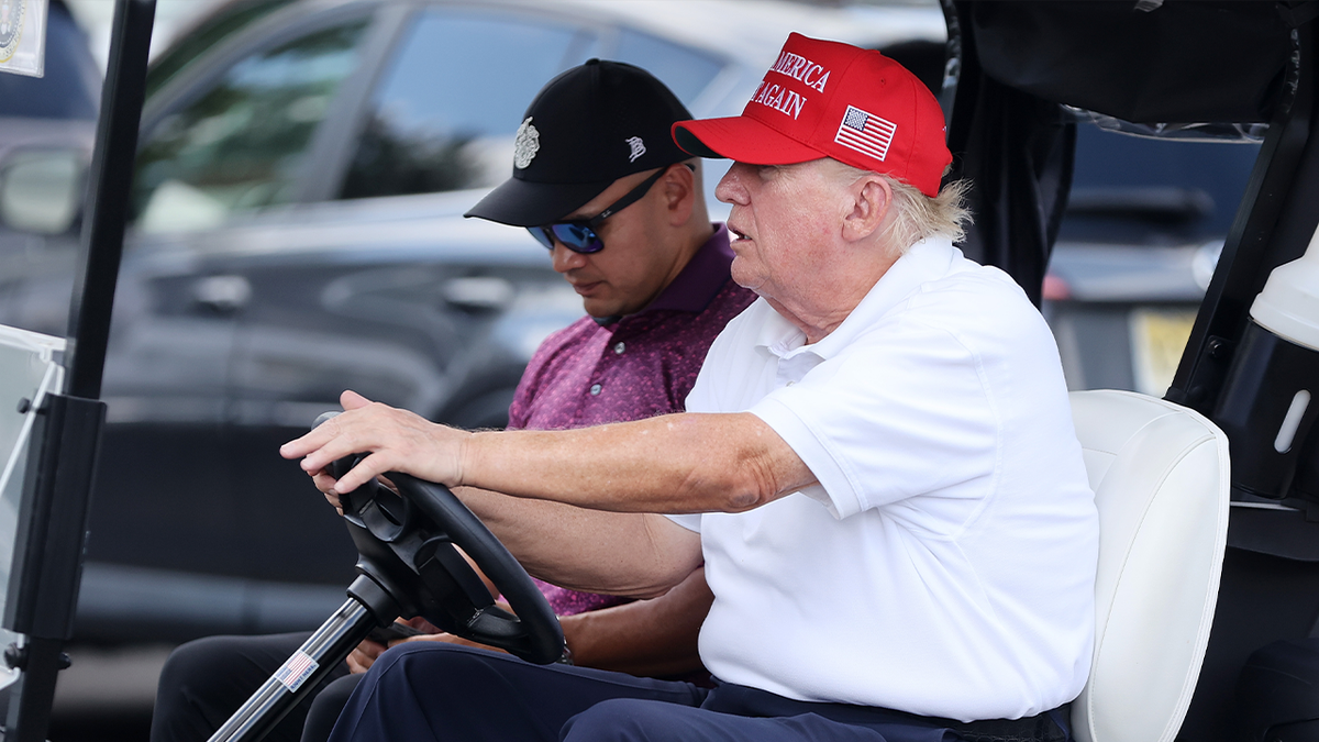 Trump in golf cart