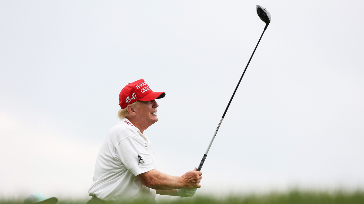  Former President Donald Trump hits his shot from the second tee during the pro-am prior to the LIV Golf Invitational - Bedminster at Trump National Golf Club on August 10, 2023 in Bedminster, New Jersey. (Photo by Mike Stobe/Getty Images)