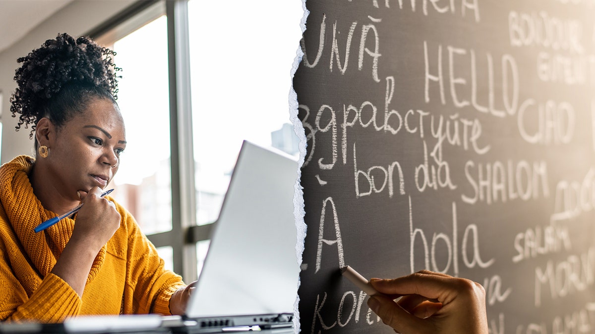 Woman moving   connected  laptop adjacent  to a photograph  of a chalkboard