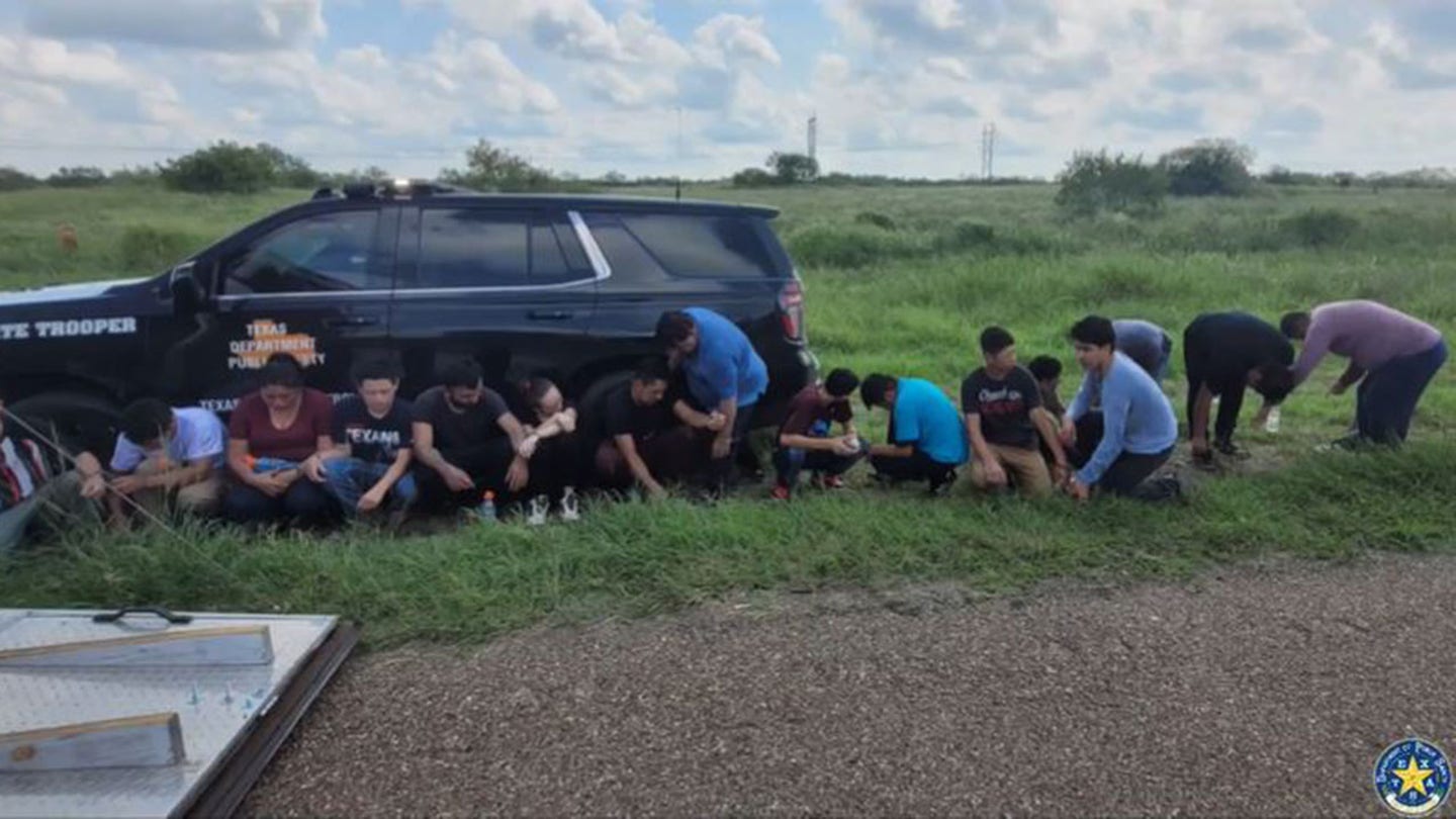 Smuggling Attempt Foiled: 16 Illegal Immigrants Found Concealed Behind False Wall in Texas Trailer