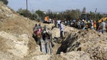 People inspect a damaged area in the aftermath of what Syrian state media reported was an Israeli strike in Masyaf, Hama province, Syria September 9, 2024.