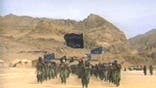 Terrorists participate in military training in this undated still frame from a recruitment video for Usama Bin Laden''s extremist Al Qaeda network. (Photo by Al Rai Al Aam/Feature Story News/Getty Images)