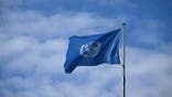 A flag of the United Nations flies at the campus of the United Nations (UN) in Bonn, western Germany on September 28, 2024. (Photo by INA FASSBENDER / AFP) (Photo by INA FASSBENDER/AFP via Getty Images)