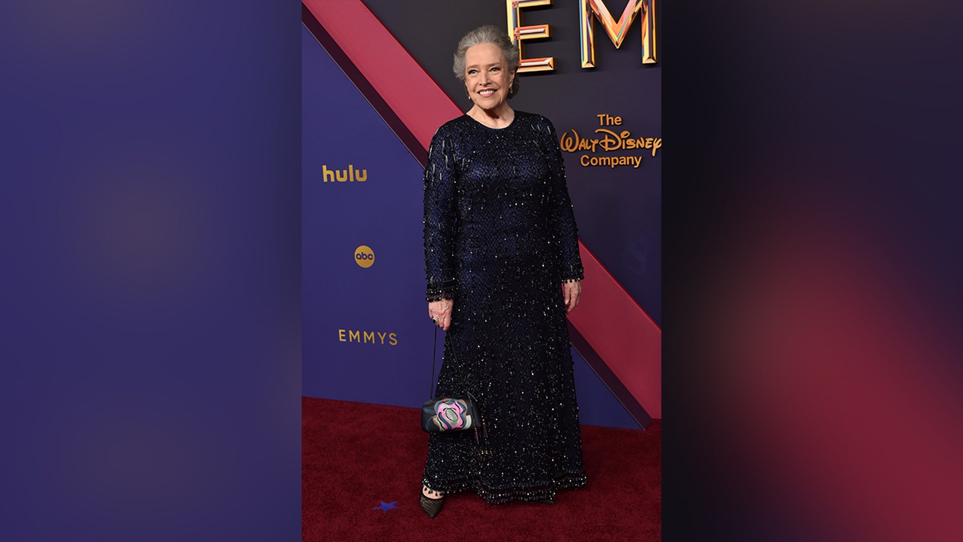 Kathy Bates in a blue Armani dress on the red carpet at the 2024 Emmy Awards.