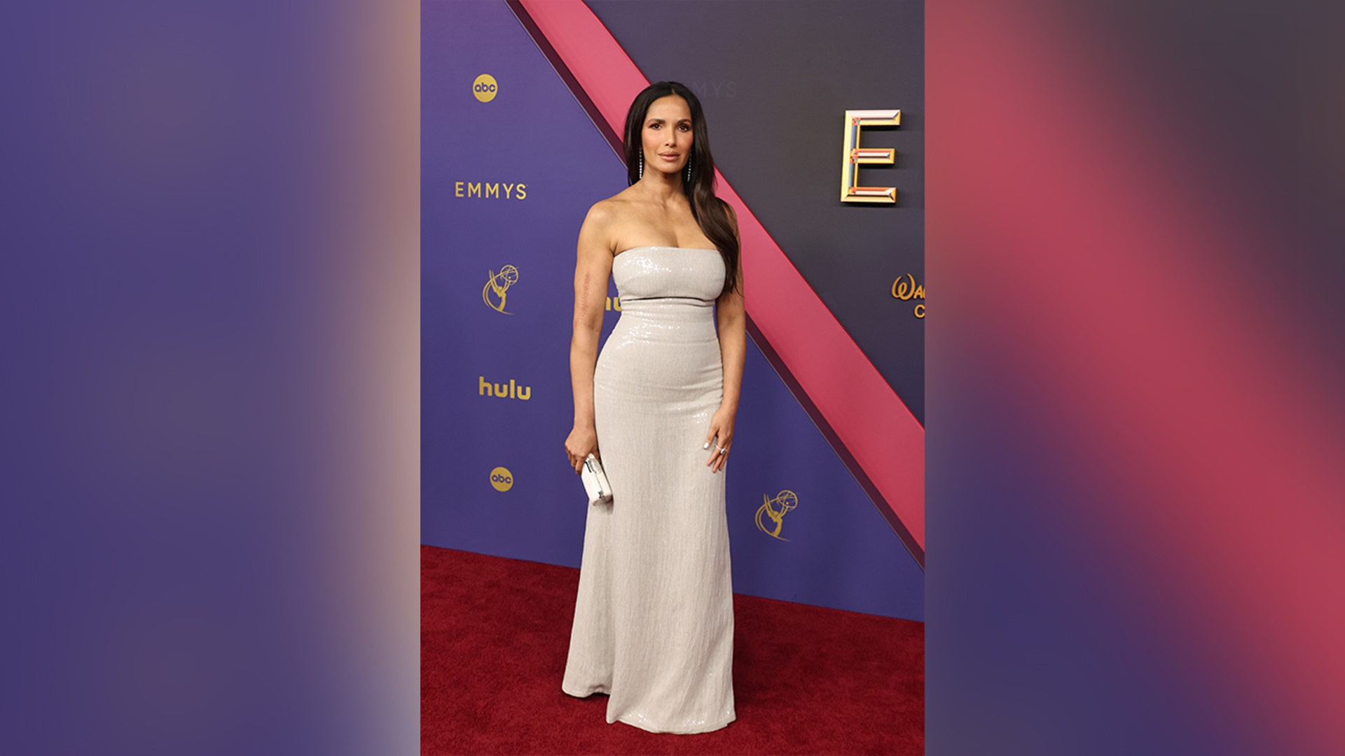 Padma Lakshmi at the 2024 Emmy Awards red carpet in a strapless dress.