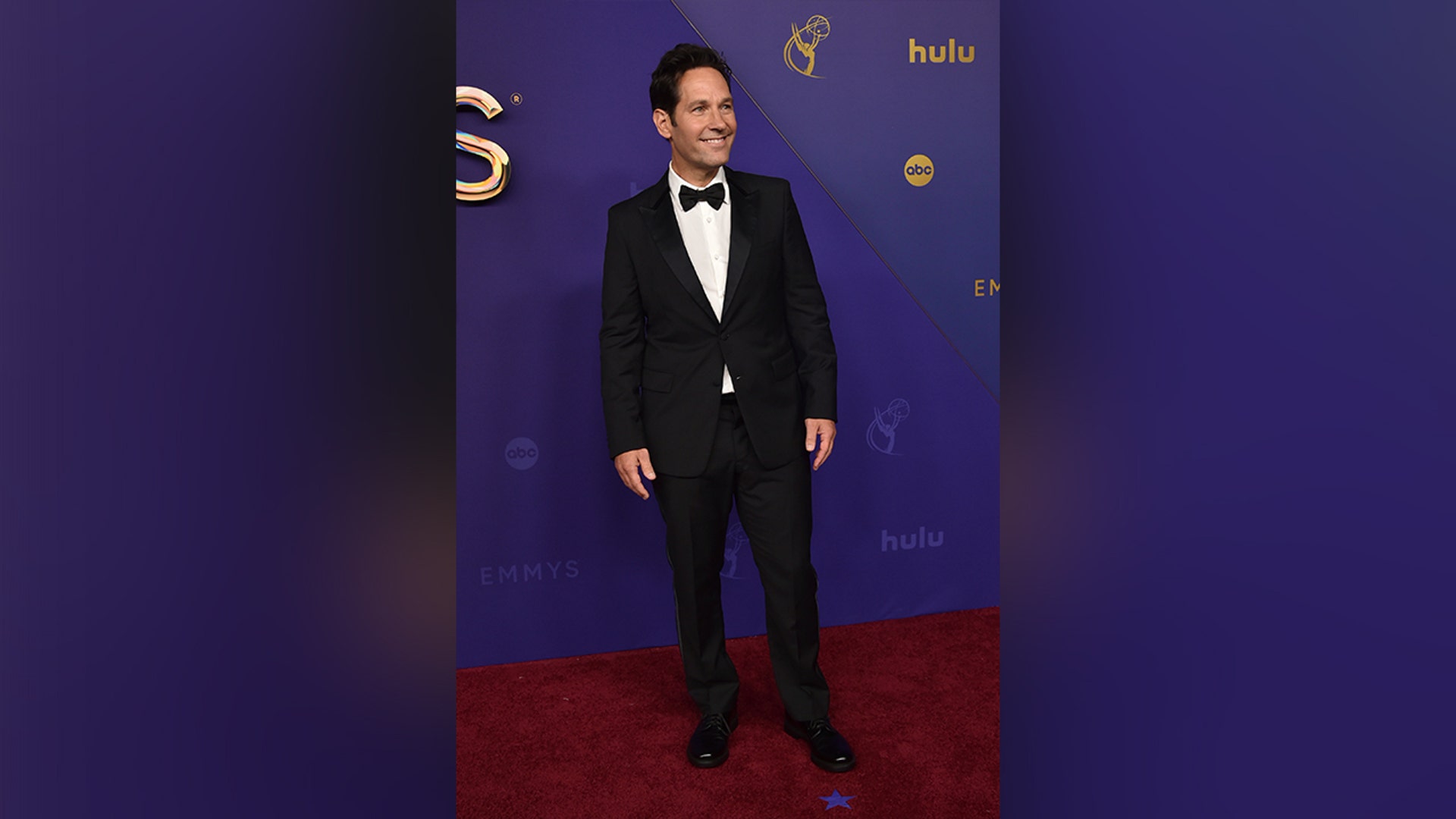 Paul Rudd, nominated for his role in "Only Murders in the Building," looked dapper in a black suit on the 2024 Emmy Awards Red Carpet.