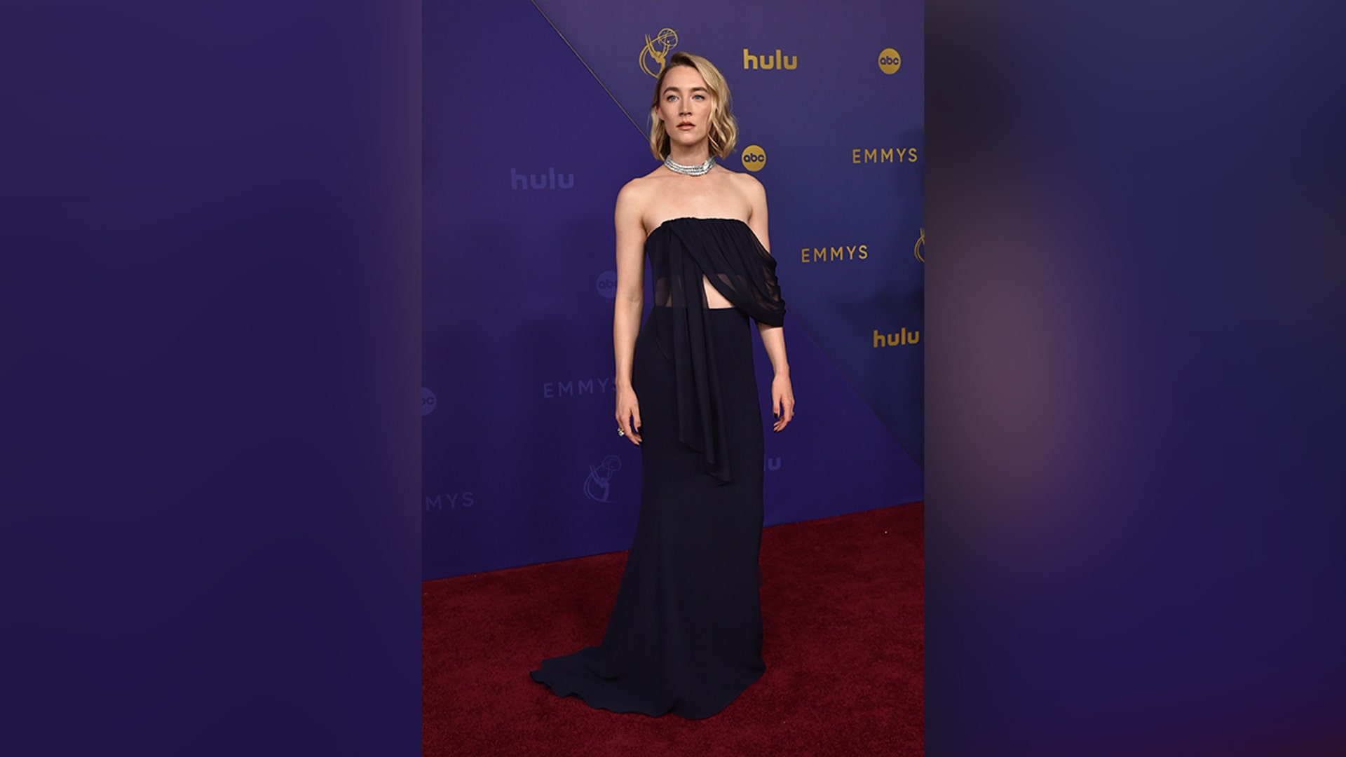 Saoirse Ronan in a flowy blue dress on the 2024 Emmy Awards red carpet.