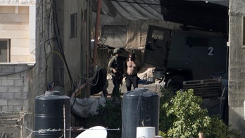 Israel reviewing incident of soldiers tossing bodies off rooftop in West Bank