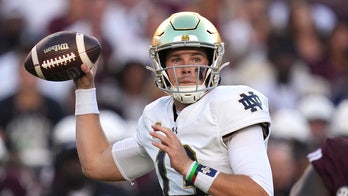 Notre Dame Quarterback's Faith on Display: Cross on Face and Bible on Wrist