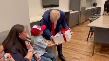 ‘Trump 2024!': Young supporter with rare brain disorder beams after surprise meeting with former president