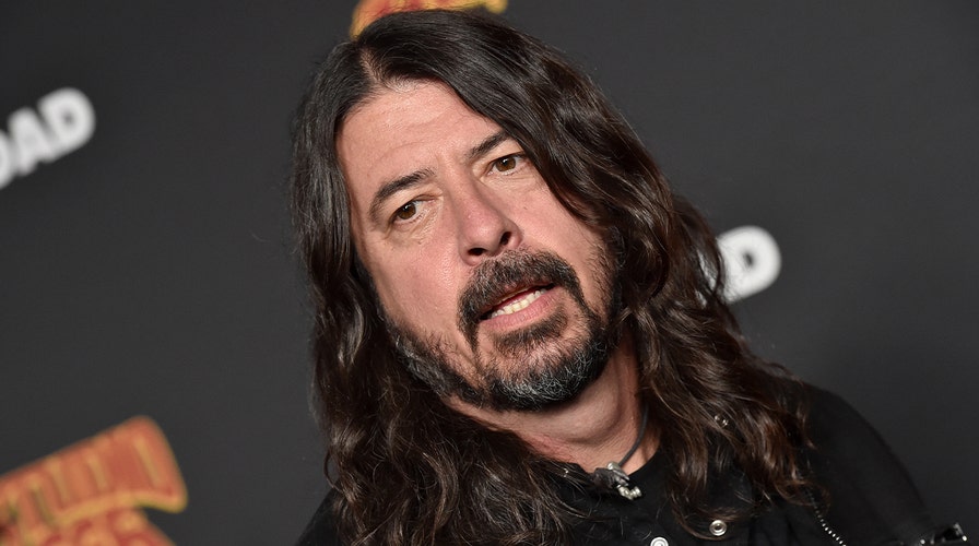 Foo Fighters' Dave Grohl chugs beer, falls off a stage during recent concert