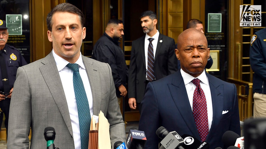 New York City Mayor Eric Adams and attorney Alex Spiro speak to the media