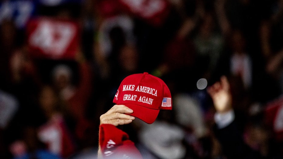 Woman forced to throw MAGA hat in trash at Cardinals game gets team's apology for staff 'misunderstanding' thumbnail