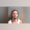 A mugshot of RJ Phifer