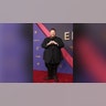 Jelly Roll on the 2024 Emmy Awards red carpet in a black suit.