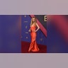 Juno Temple, nominated for her role in "Fargo," on the 2024 Emmys red carpet in an orange dress.