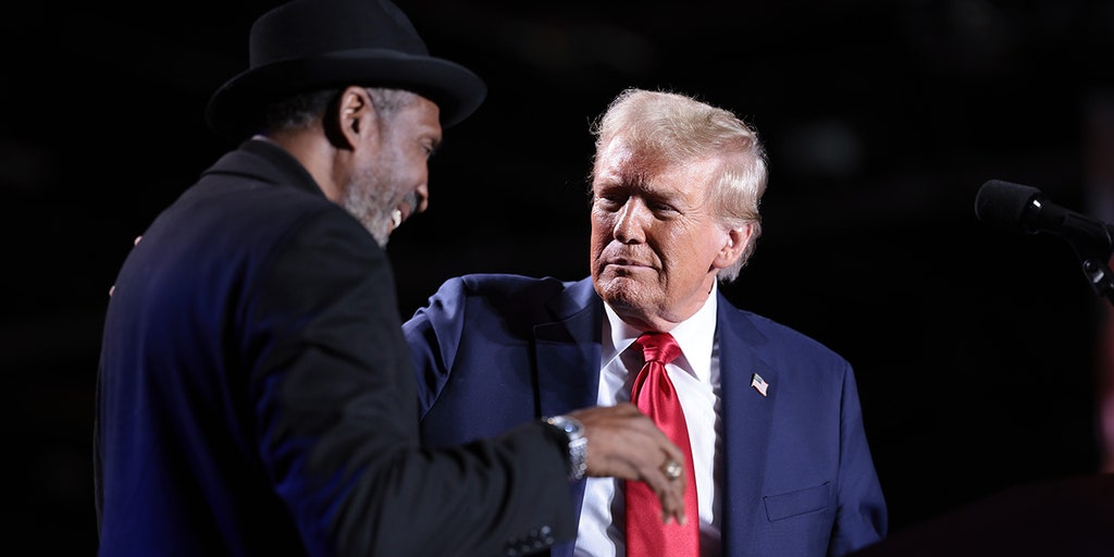 Boxing Hall of Famer Thomas 'Hitman' Hearns joins Trump on stage at Detroit rally: 'This can't be real'