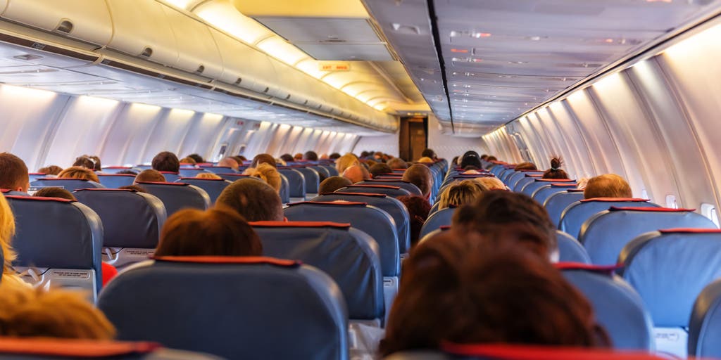 Flight passenger ignites debate after posting photo of traveler's coat thrown over seat