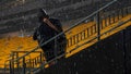 A spectator stands under driving range during a weather delay prior to an NFL football game between the Pittsburgh Steelers and the Dallas Cowboys, Sunday, Oct. 6, 2024, in Pittsburgh. - Fox News