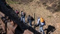 A family of Central American migrants hoping to reach the United States in hopes of a better life, walk after crossing the US-Mexico border fence from Tijuana, Baja California State, Mexico, to the US, on December 30, 2018. - Outgoing White House chief John Kelly said he had "nothing but compassion" for undocumented migrants crossing into the US and undercut the idea of a border wall in an interview published Sunday that jarred with President Donald Trump's rhetoric on immigration. - Fox News