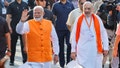 Indias Prime Minister Narendra Modi (L) walks alongside Amit Shah, Indian Home Minister and leader of Indias ruling Bharatiya Janata Party (BJP) on the day he casts his vote, outside a polling station during the third phase of the general election, in Ahmedabad, India, May 7, 2024. - Fox News