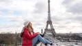 Happy female tourist taking pictures to the Eiffel Tower in Paris - people traveling concepts - Fox News