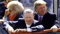 World Series, View of New York Yankees owner George Steinbrenner (C) victorious with wife Joan (L) and celebrity businessman Donald Trump (R) aboard bus during ticker tape parade on Broadway after winning vs San Diego Padres, New York, NY 10/23/1998. - Fox News