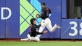 Tyrone Taylor #15 of the New York Mets slides to make a catch while colliding with Starling Marte #6 in the second inning against the Los Angeles Dodgers during Game Three of the National League Championship Series at Citi Field on October 16, 2024 in New York City. - Fox News