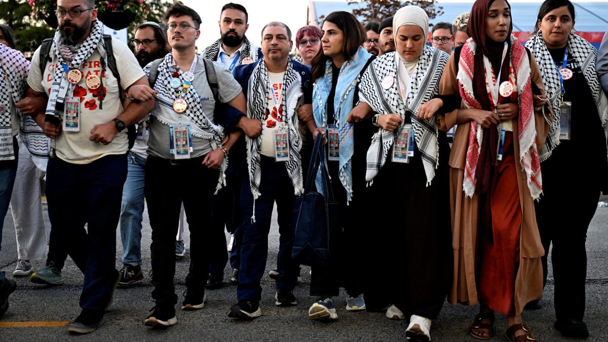 Pro-Palestinian uncommitted delegates take part in a demonstration outside the venue on Day 4 of the Democratic National Convention (DNC).
