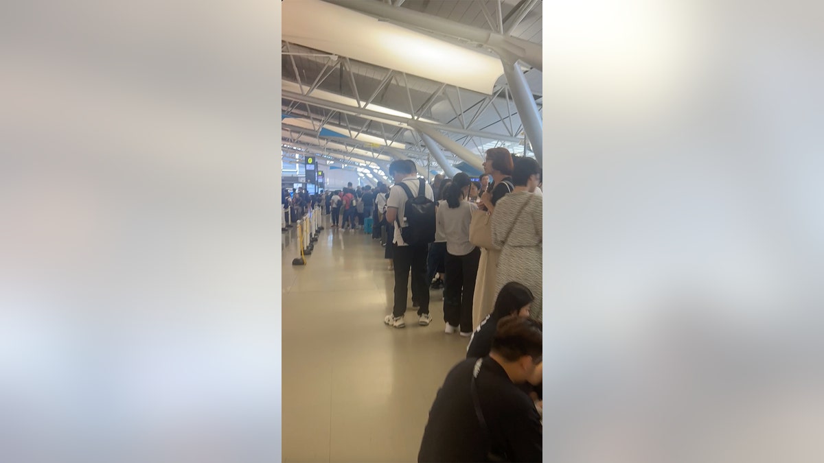 Jordyn and JT wait in line for 3 hours at the airport